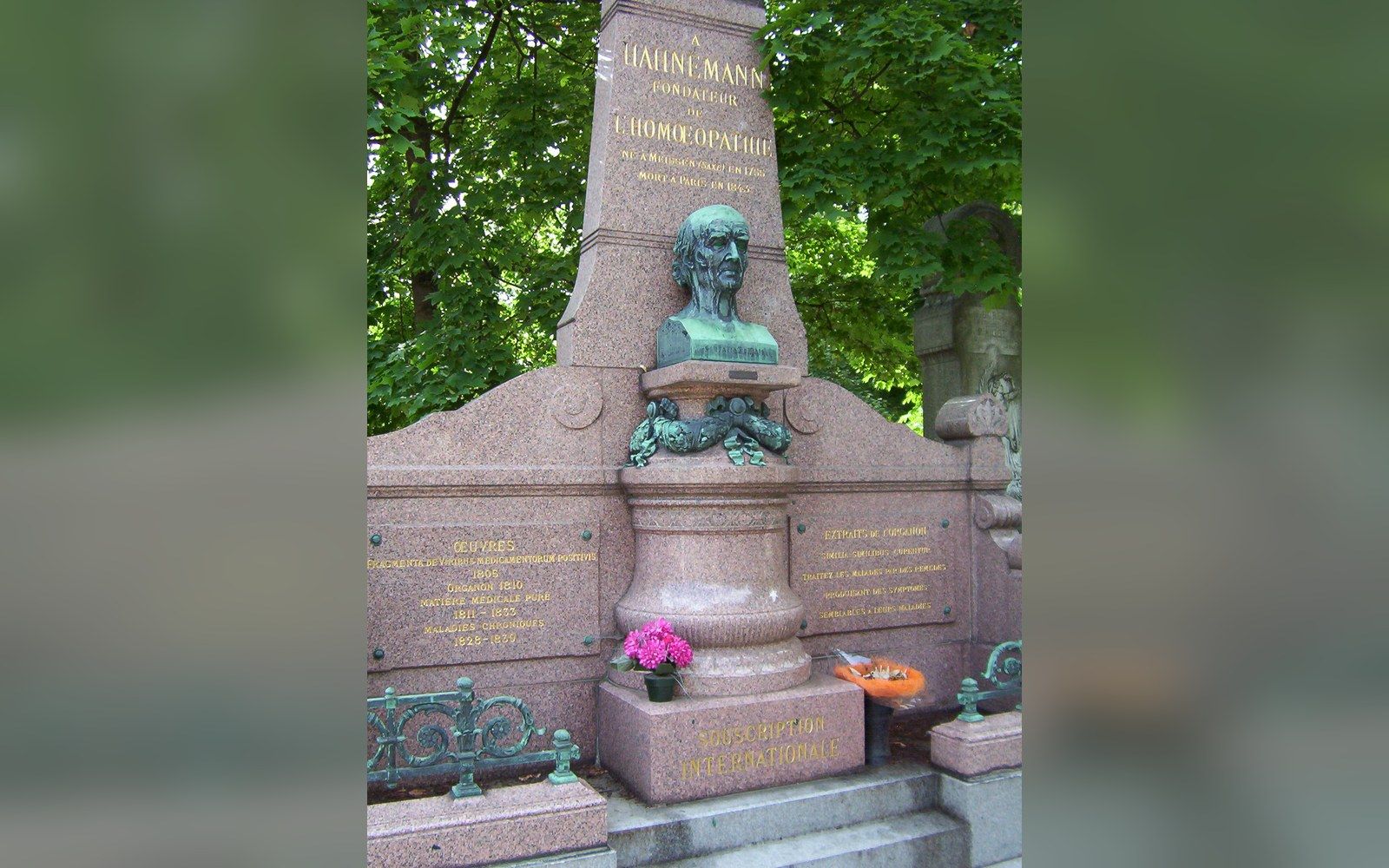 Pink granite monument with a bronze bust honoring Hahnemann, founder of homeopathy